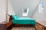 The cozy fourth bedroom has a full bed